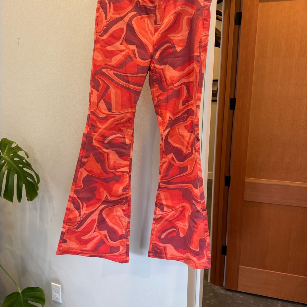 We The Free Red-Orange Swirl Flare Pants